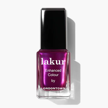 A bottle of LONDONTOWN nail polish in the "Alexa, Let's Dance!" metallic magenta shade, featuring "lakur Enhanced Colour by LONDONTOWN" on the front label.