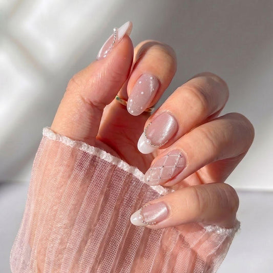 Stylish hand wearing EyeCandys Ballet Slippers press on nails featuring quilted texture nails and glossy ballet pink finish.