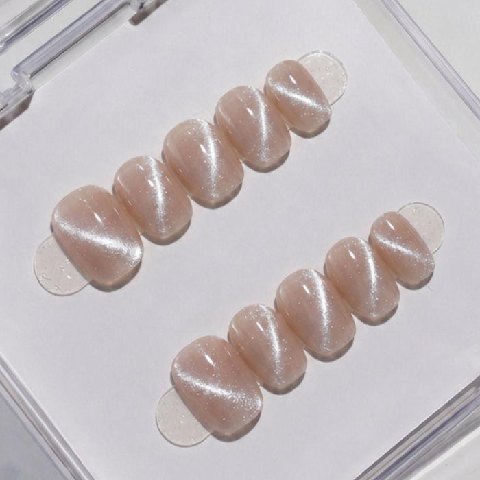 EyeCandys Business Casual press on nails featuring dusty grey taupe nails with fine silver micro glitter shimmer and glossy finish in a short round shape.