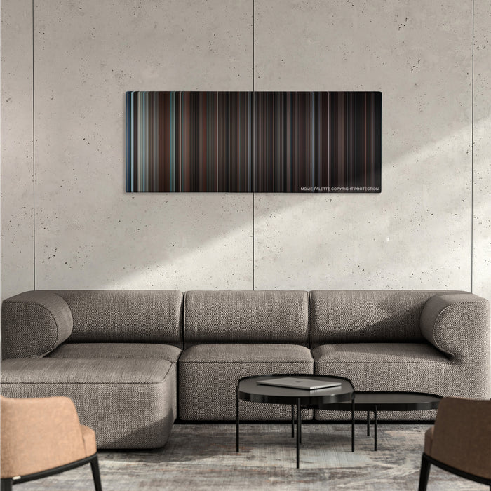 Devil color palette canvas on a concrete wall above a gray sectional sofa
