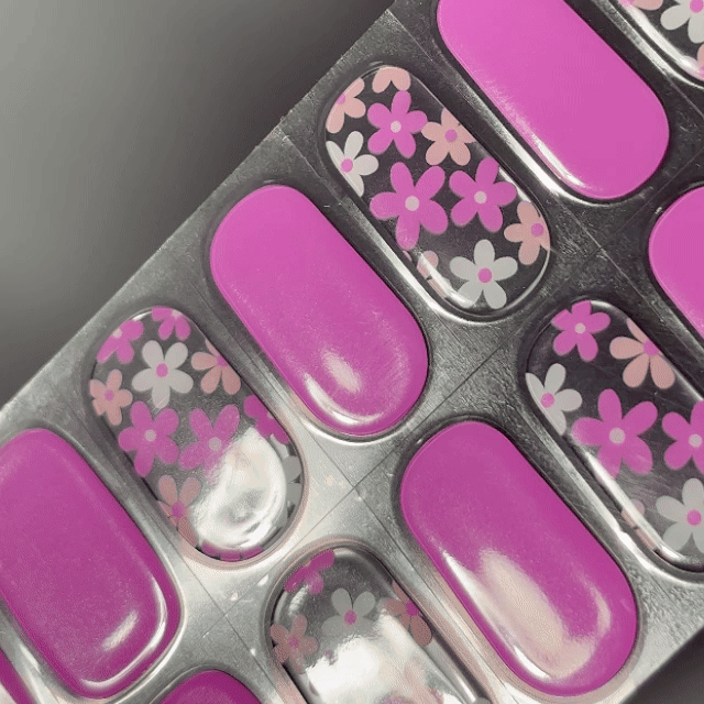 EyeCandys Flower Girlire Gel Nail Sticker showcases a vibrant magenta pink paired with clear tips, layered with subtle white floral accents. This semi-cured gel set adds a playful yet polished touch—perfect for spring moods, casual charm, or standout nail art with salon-level longevity.