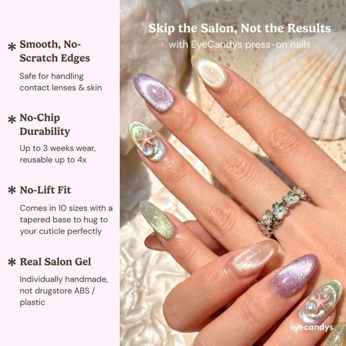 Close up hand showcasing EyeCandys Mermaid on Duty press on nails with multicolor cat eye nails, holographic shimmer, and starfish accents.
