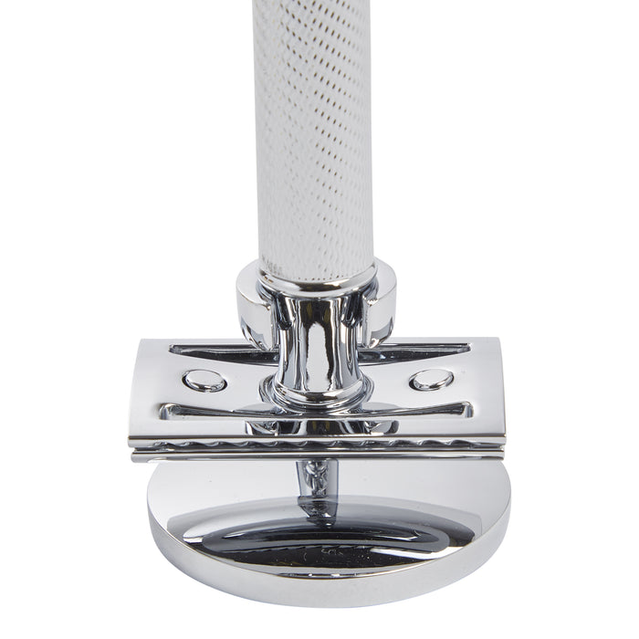 An elegant man's bathroom accessory - a chrome shaving razor on top of a KirbyAllison.com Safety Razor Stand.