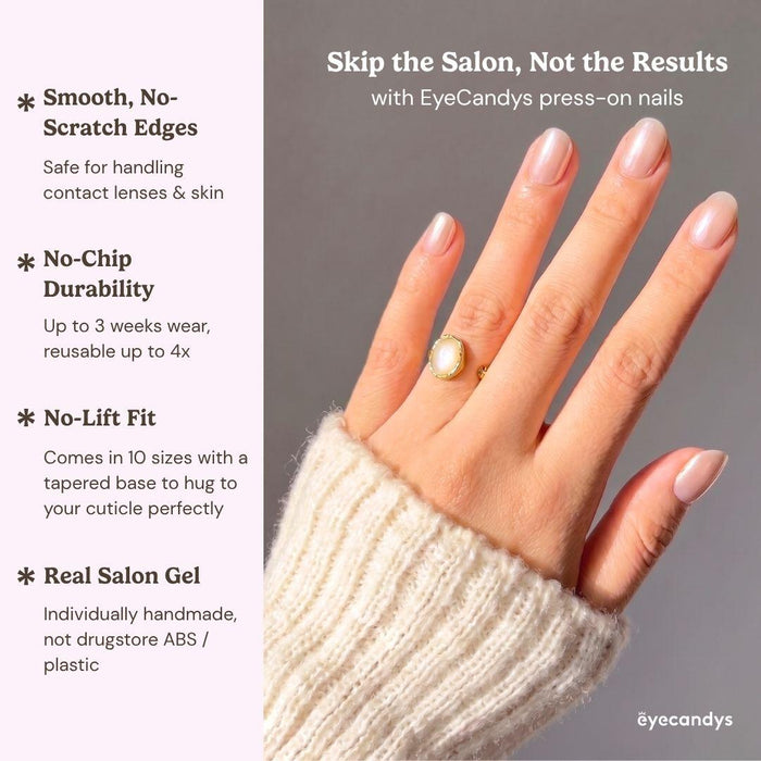 Detailed view of Eyecandys Silk Slip press-on nails highlighting a reflective champagne pink chrome finish, pearlescent glow, and glossy glazed manicure.
