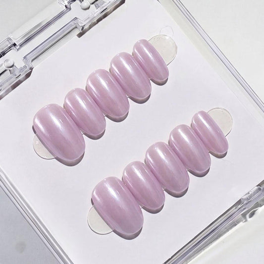 Eyecandys Taro Latte press-on nails featuring a soft taro purple chrome finish, pearlescent glazed shine, and a short oval shape.