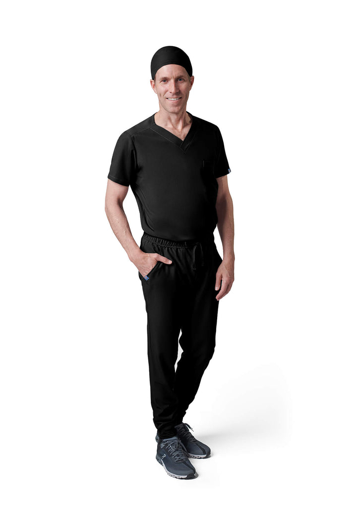 Man wearing MedTailor men's custom scrub cap in Jet Black color fabric