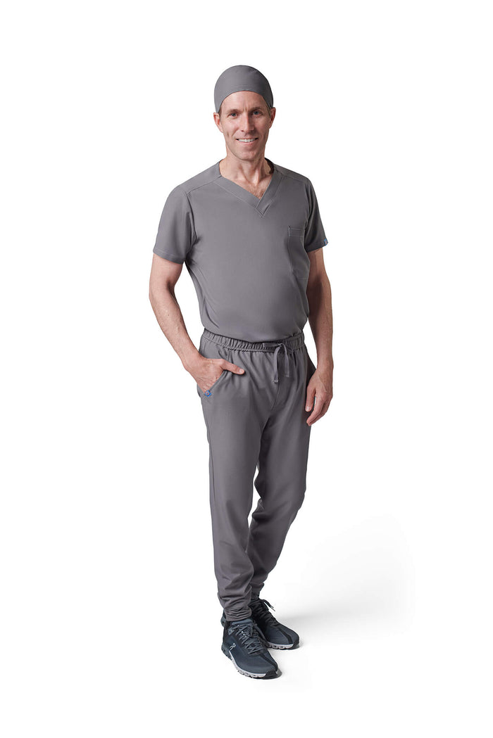 Man wearing MedTailor men's custom scrub cap in Platinum Gray color fabric